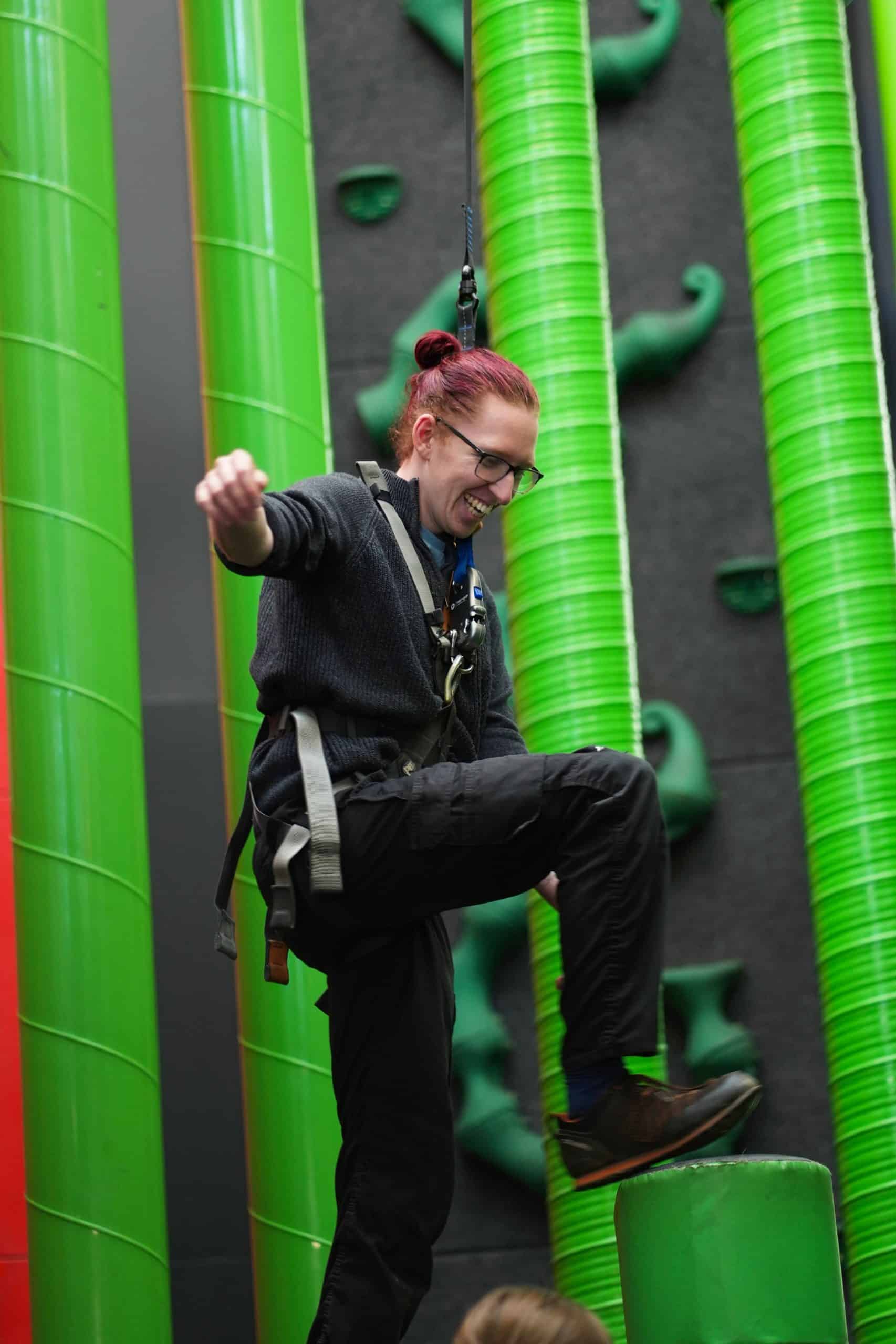 Someone stepping onto a vertical green pipe of the Stairway to Heaven